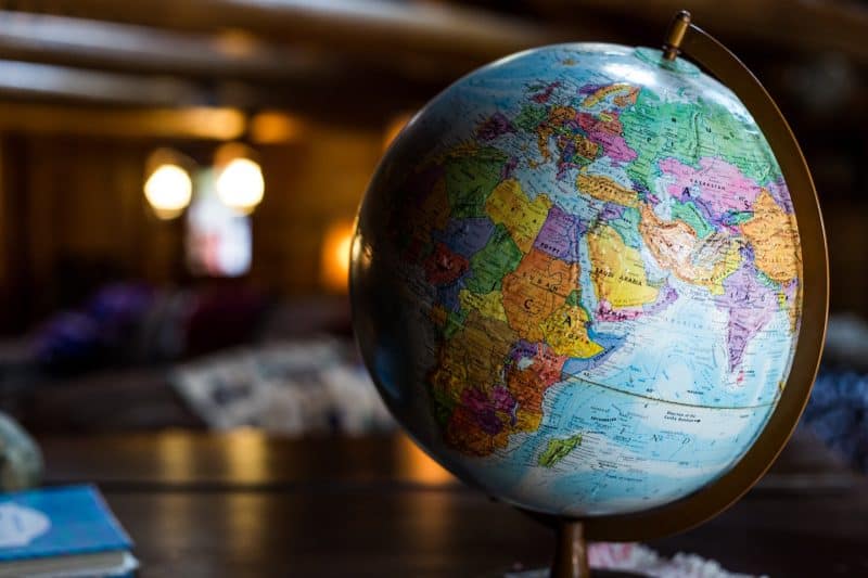 Best Travel Blog Names: How to Pick a Good One!, round desk globe sitting on table